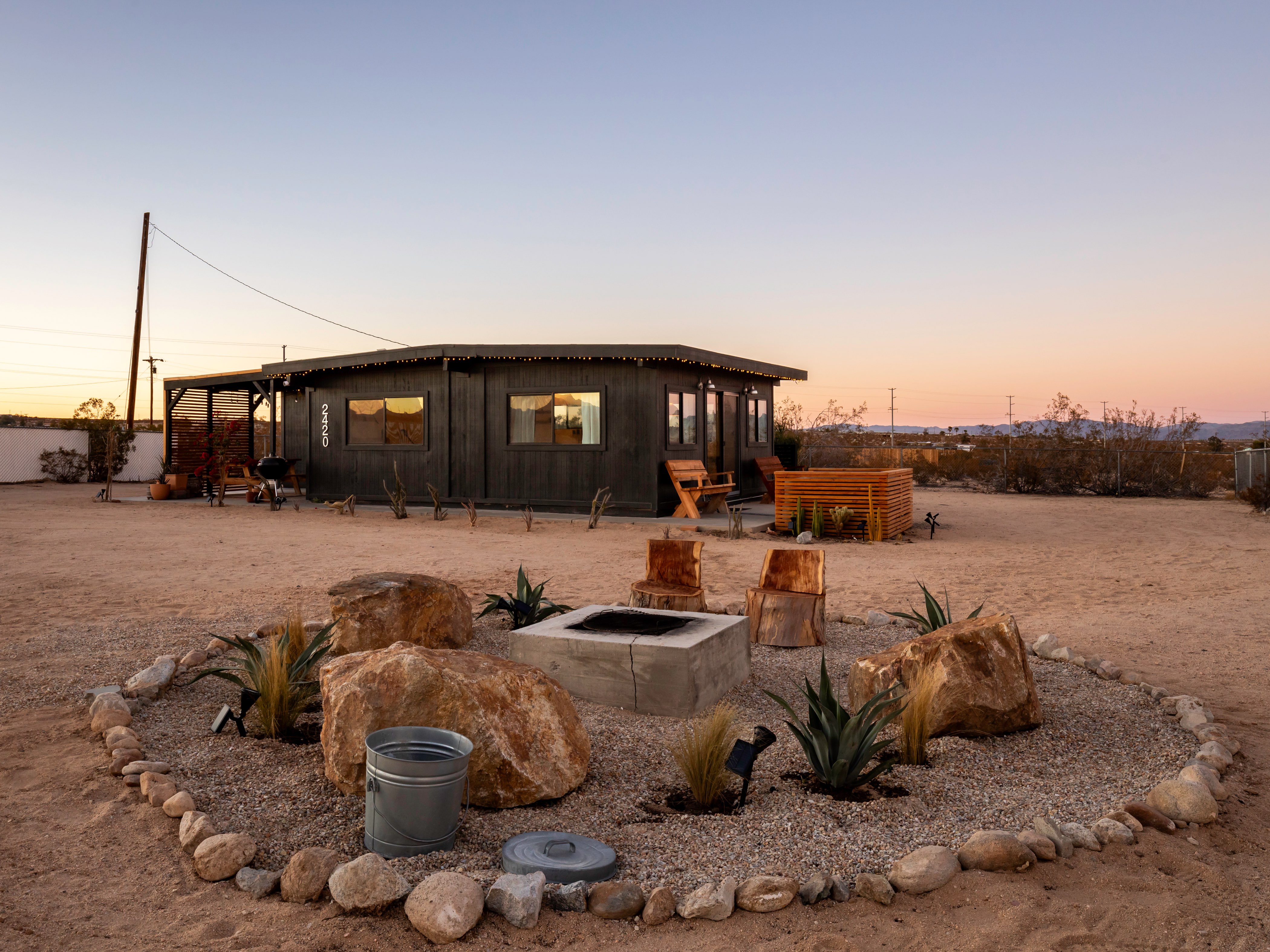 Bluegrass desert cabin at sunset in Joshua Tree