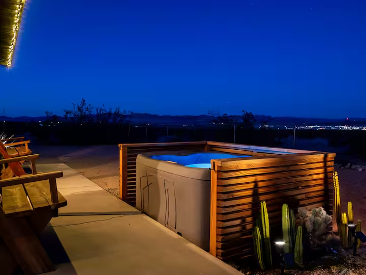 Joshua Tree outdoor hot tub at night with desert views